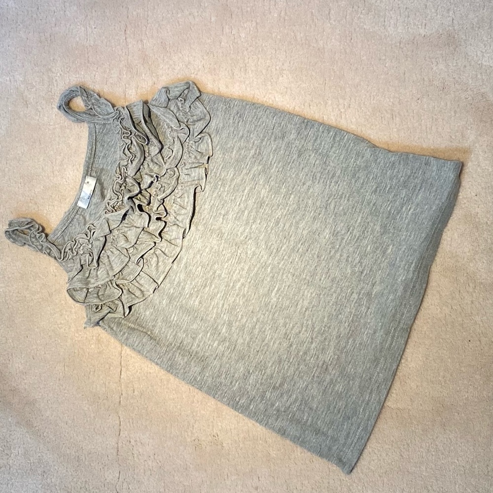 I am selling and adorable gray (11-12 years) blouse for girls just new